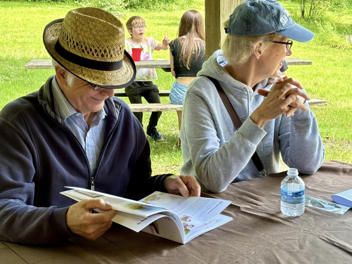 A couple looking at informational materials