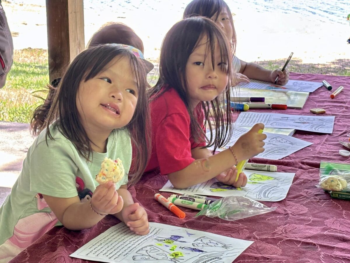 Kids enjoying treats and coloring activities