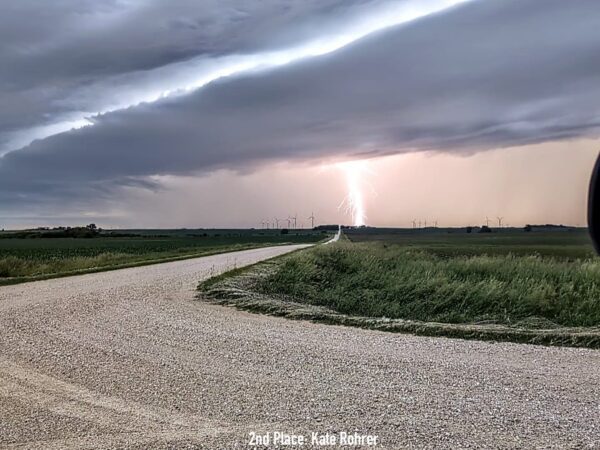 Lightning bolt in the distance over a gravel road